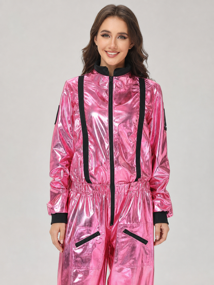 The pink NASA astronaut costume is designed as a one-piece jumpsuit with long sleeves, a stand-up collar, and a central zip closure. The model is pink with black decorative elements: a vertical stripe on the front, zippered side pockets, ho