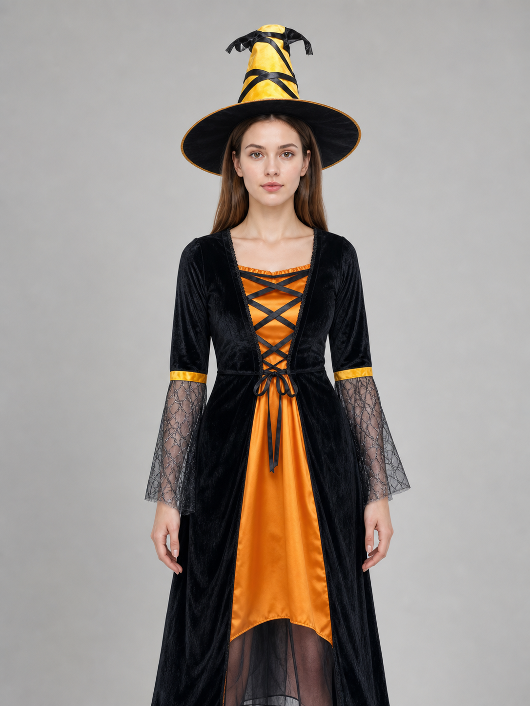 This Halloween costume includes a long dress and a pointed hat. The dress is in a black-and-orange color scheme: the center features a bright orange panel, and the black outer layer has a flared hem. The semi-sheer sleeves are decorated wit
