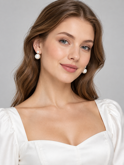 Earrings with white glossy round beads in two sizes