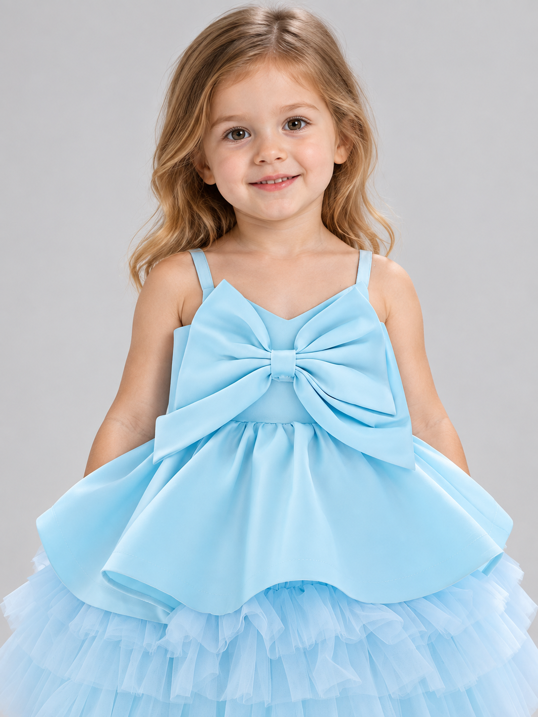 Blue children's holiday dress with a bow and a puffy skirt