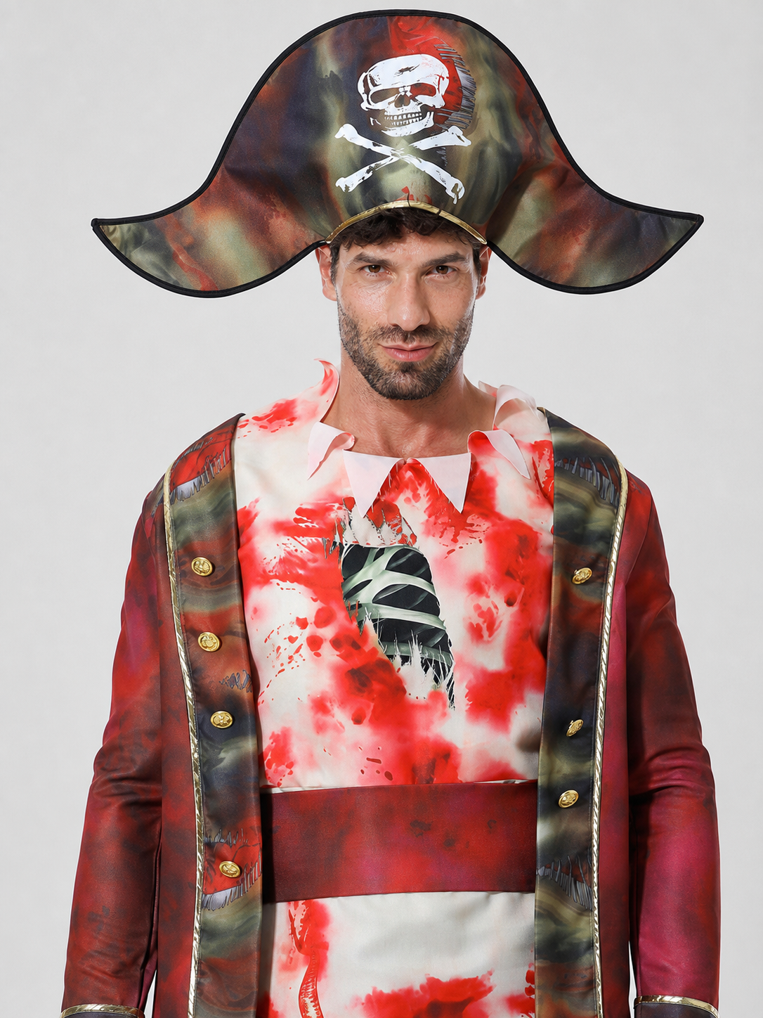 The set features a pirate-style design and includes a one-piece costume with long sleeves and pants, a wide-brim pirate hat, and a black curved blade-shaped accessory. The design combines brown, white, red, and black colors. The front featu