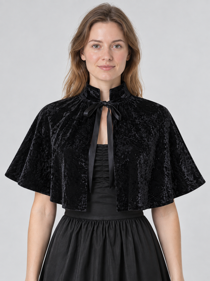 Black velvet cape with high collar and ties