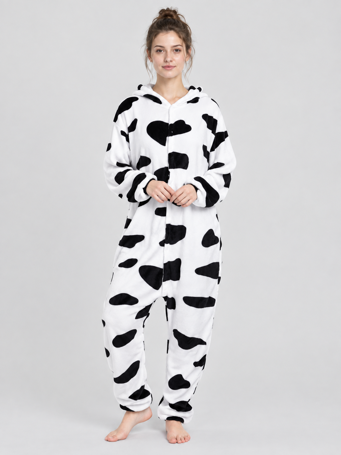 White pajama jumpsuit with black spots and a hood