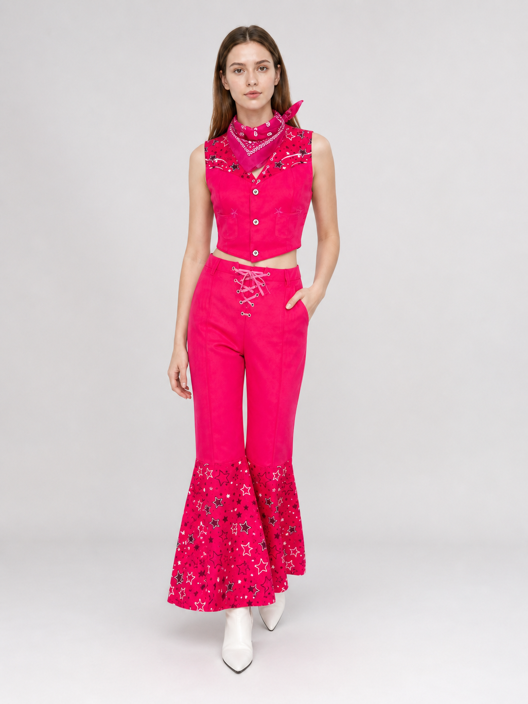 Barbie-style cosplay set consisting of two pieces: a cropped sleeveless top and flared-leg pants. The top resembles a vest with a front button closure, a decorative yoke, and a styled collar area. The pants have a high waist, front lacing, 